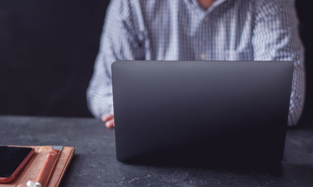 man working using a laptop